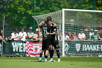 Dawid Kownacki celebrates with his teammates.