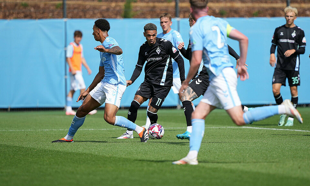 Justin Njinmah takes a shot on goal.