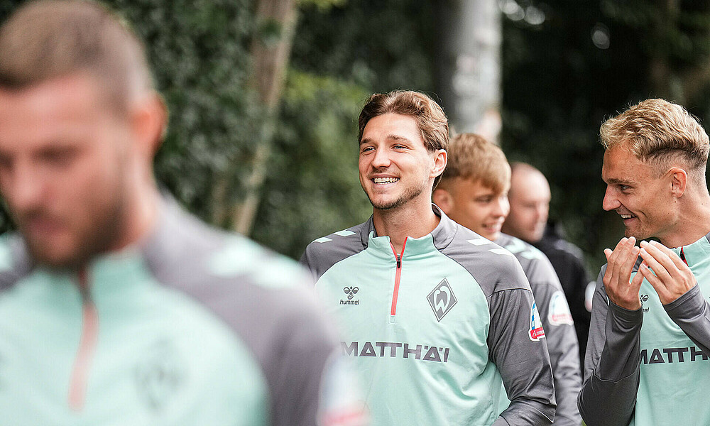 Niclas Stark laughs en route to the training pitch.