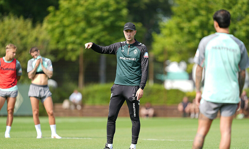 Ole Werner gestures during training