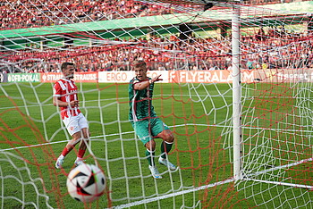 Topp looking at the ball in the back of the net.