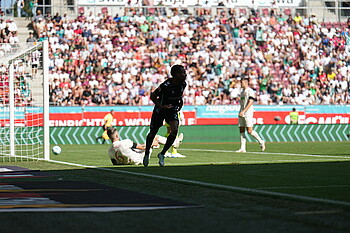 Felix Agu celebrates after opening the scoring in Augsburg.