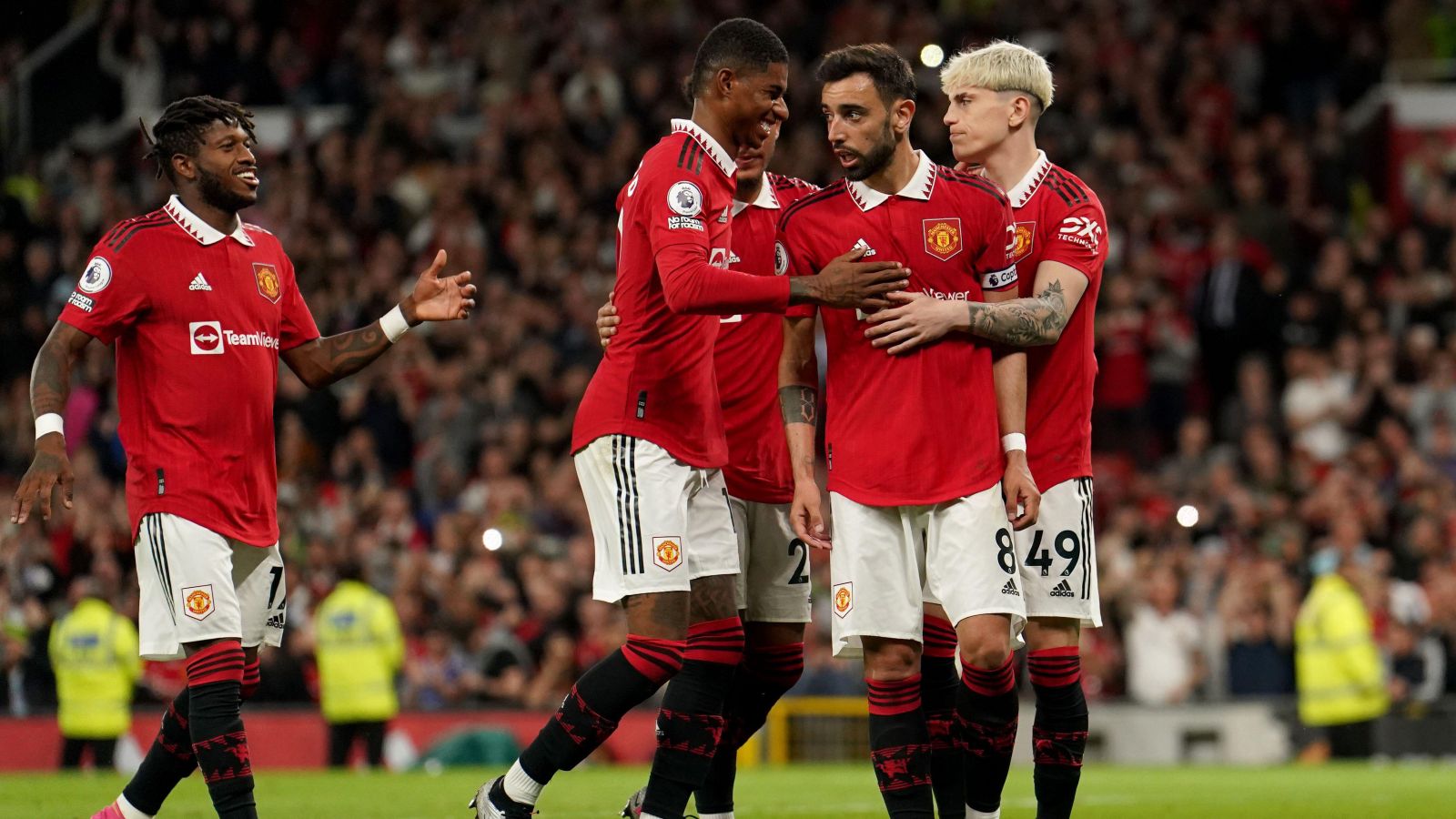 Man Utd midfielder Bruno Fernandes celebrates scoring a penalty against Chelsea with his teammates