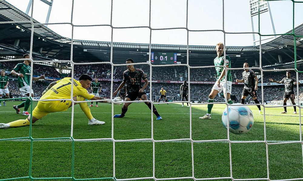 Musiala scores while Zetterer and Pieper watch.