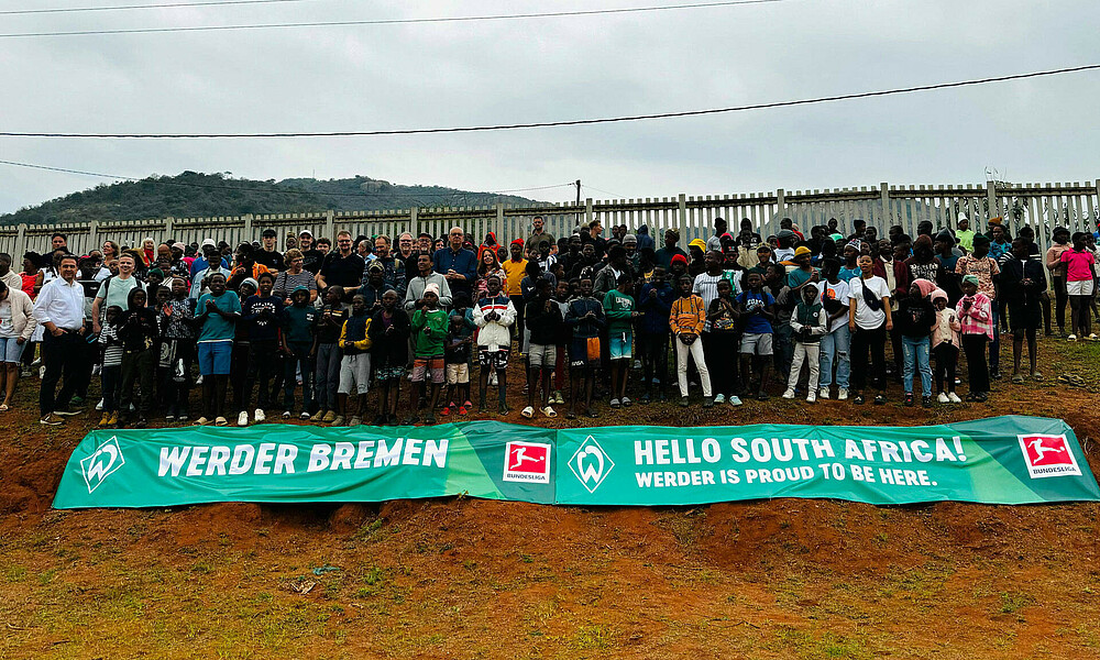 A large group of people stood together.