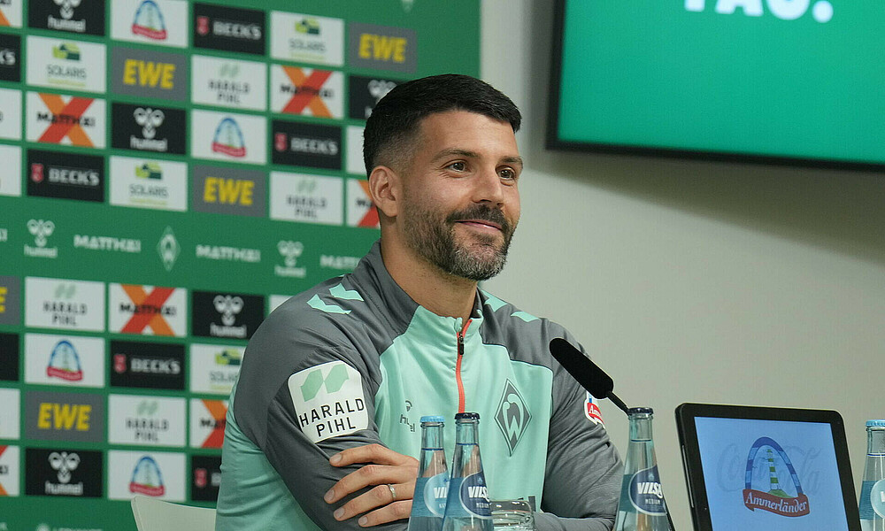 Anthony Jung smiles in an interview at the Weserstadion.