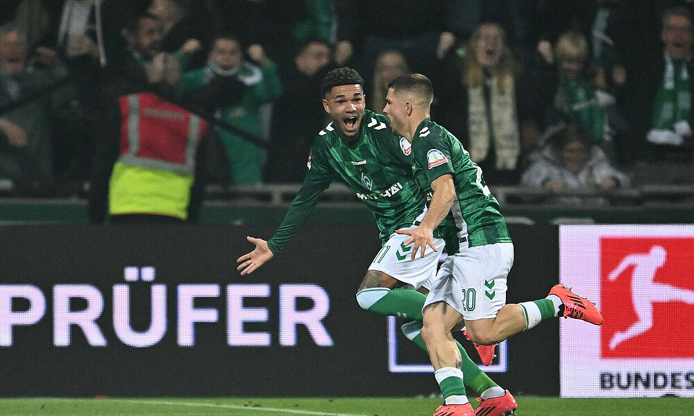 Romano Schmid and Justin Njinmah celebrate after the goal against Leverkusen.