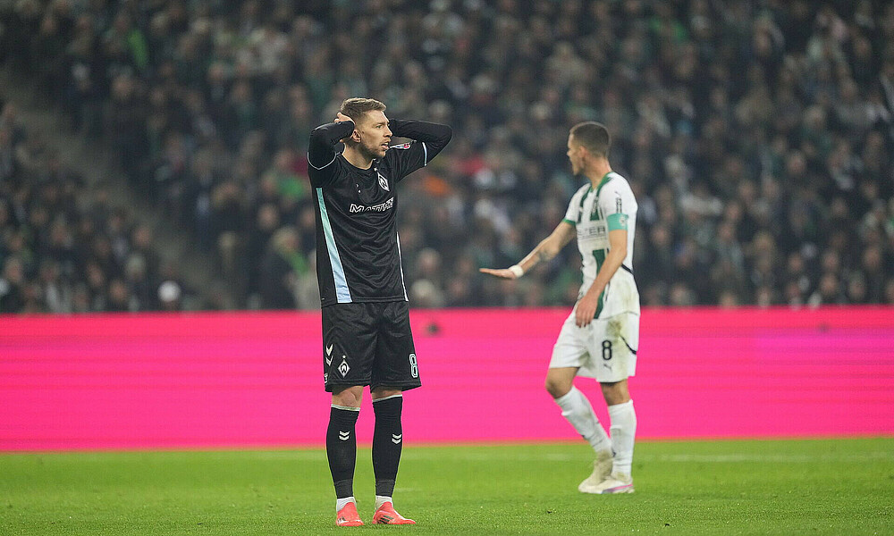 Mitchell Weiser reacts after being shown a second yellow by the referee.