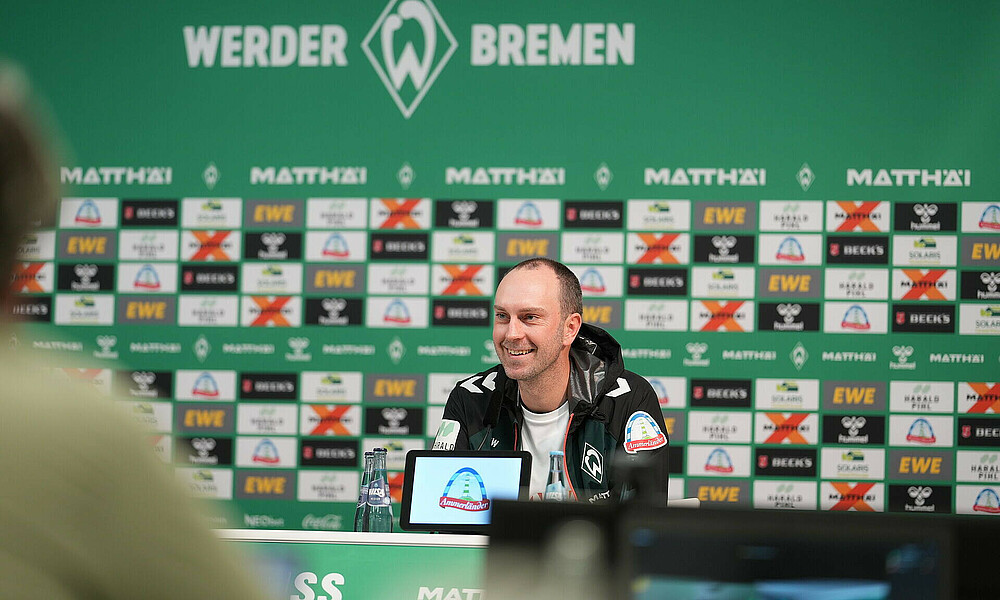 Head coach Ole Werner smiles in the press conference ahead of the home clash with Holstein Kiel